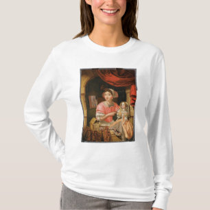 Mädchen, das eine Puppe in einem Innenraum hält T-Shirt