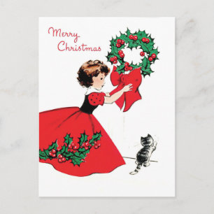 Mädchen im roten Kleid mit Weihnachtskranz und ein Postkarte