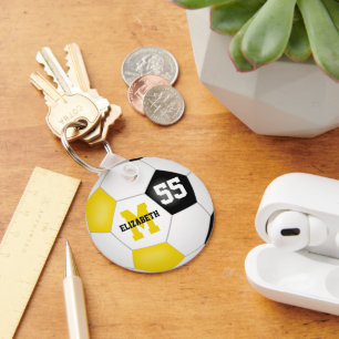 Mädchen Jungs schwarzes Gold Mannschaft Farben Fuß Schlüsselanhänger