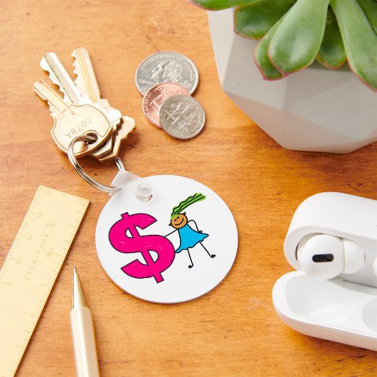 Mädchen mit einem Dollar-Zeichen Schlüsselanhänger