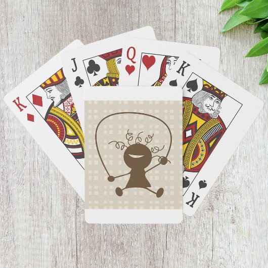 Mädchen mit Sprungklumpen, die Karten spielen Spielkarten