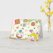 Mädchen und Junge, die mit Tafel spielen Karte (Gelbe Blume)