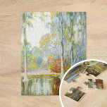 Magnolia Gardens | Alfred Hutty Puzzle<br><div class="desc">Magnolia Gardens (1920) | Alfred Hutty's Magnolia Gardens ist ein Vintages Gemälde, das die Schönheit eines Südgartens in voller Blüte einfängt. Die Szene zeichnet sich durch ruhige, von blühenden Magnolienbäumen gesäumte Wasserwege aus, deren Blüten eine malerische Reflexion auf dem stillen Wasser schaffen. Huttys Verwendung von zarten Farben und feinen Details...</div>