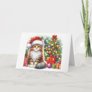 Maine Coon Kätzchen sitzt neben dem Weihnachtsbaum Feiertagskarte