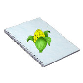 Mais auf dem Cob mit blauem BKD-Notebook Notizblock (Rechte Seite)