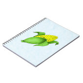 Mais auf dem Cob mit blauem BKD-Notebook Notizblock (Linke Seite)