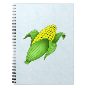 Mais auf dem Cob mit blauem BKD-Notebook Notizblock