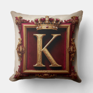 Majestätiges goldenes Monogramm mit Krone auf köni Kissen