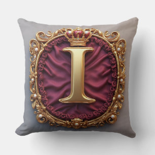 Majestätiges goldenes Monogramm mit Krone auf köni Kissen