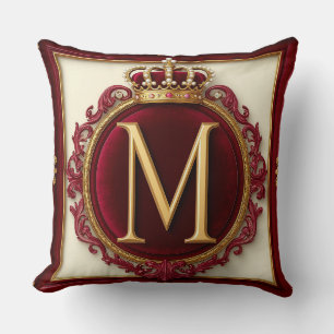 Majestätiges goldenes Monogramm mit Krone auf köni Kissen