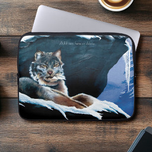 Majestätischer Winterluchs ruht auf schneebedeckte Laptopschutzhülle