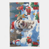 Malti Tzu läuft im Schnee mit Weihnachtshut Geschirrtuch (Vertikal)