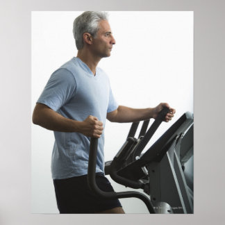 Man exercising on Stairmaster Poster