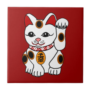 Maneki Neko Katze auf rotem Hintergrund Fliese