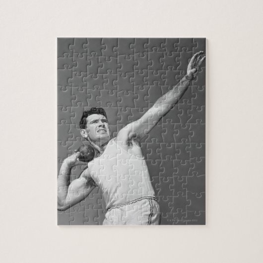 Mann, der Shotput wirft Puzzle (Vertikal)