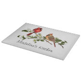 Männlich-weiblicher Kardinal auf Schneidebrett (Ecke)