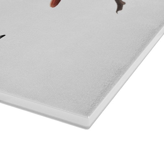 Männlich-weiblicher Kardinal auf Schneidebrett (Ecke)