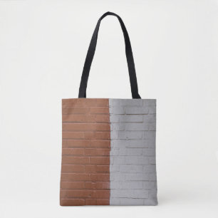 Mauer aus braunem und weißem Beton Tasche