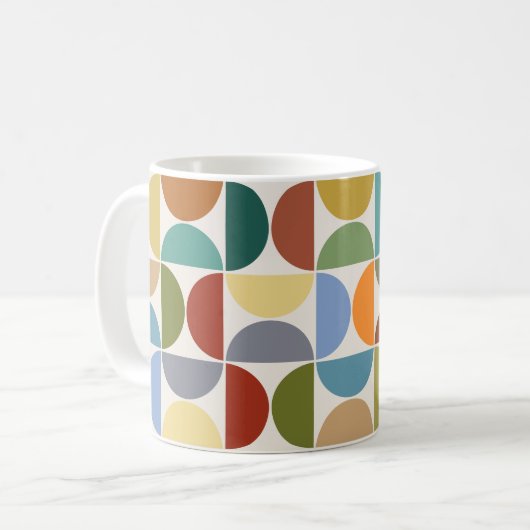 MCM simuliert Musterfarbe auf Creme Kaffeetasse (Vorderseite Links)