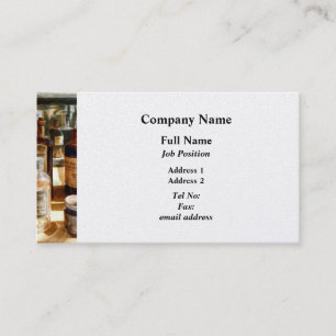 Medizin-Flaschen im Glaskasten Visitenkarte