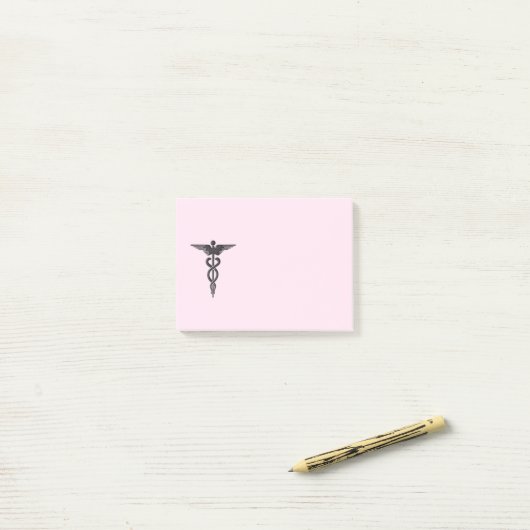 Medizinischer Caduceus auf Rosa Post-it Klebezettel (Auf Schreibtisch)