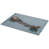 Meeresotter, der im Ozean zurückschweben Schneidebrett (Ecke)