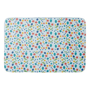 Meeresstrand mit Seestern, Muscheln und Kies Badematte