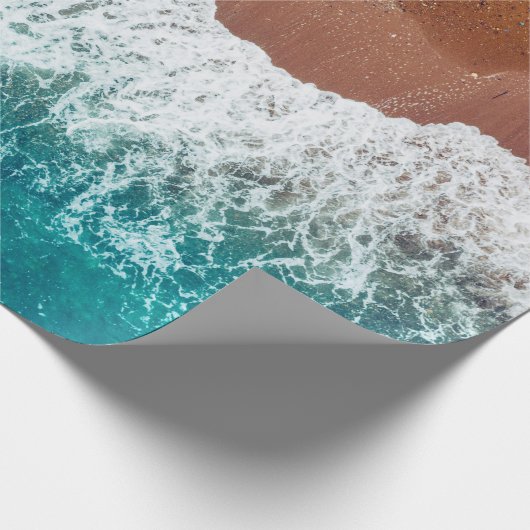 Meereswelle am Sandstrand, Aussicht auf den Hinter Geschenkpapier (Ecke)