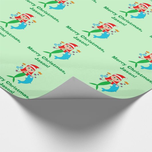 Meerjungfrau mit Weihnachtsmannmütze-und Geschenkpapier (Ecke)