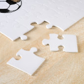 Meerkat als Fußballspieler mit Fußball Puzzle (Seite)