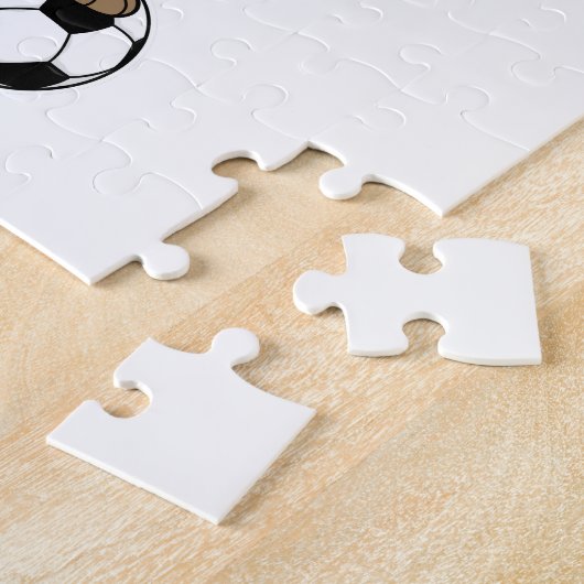 Meerkat als Fußballspieler mit Fußball Puzzle (Seite)