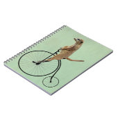 Meerkat auf Black Penny Farthing 2 Notizblock (Linke Seite)