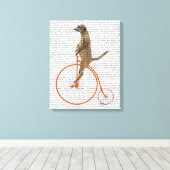 Meerkat auf Orange Penny Farthing Leinwanddruck (Insitu (Holzboden))