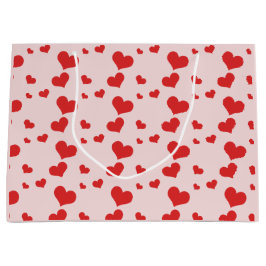 Mehrere rote Herzen auf einer niedlichen Geschenkt Große Geschenktüte