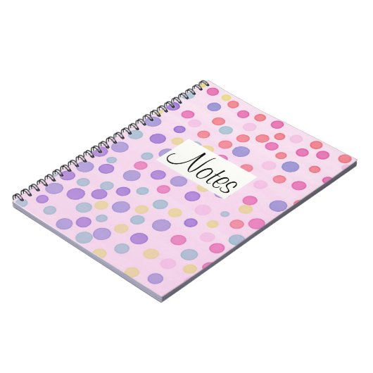 Mehrfarbenpunkte auf Pastellrosa Notizblock (Linke Seite)