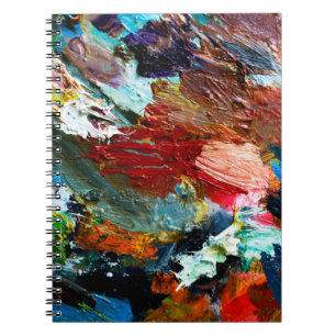 mehrfarbige Linien der Ölfarbe auf den Künstlern Notizblock