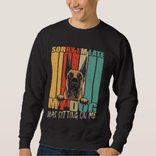 Mein Hund saß auf meinem lustigen Vater, der selbs Sweatshirt