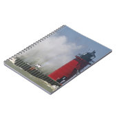 Menschen auf dem Jet sehen große Wellen in 2 Notizblock (Linke Seite)