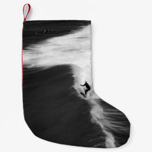 MENSCHENSCHIRM AUF GROSSEN WELLEN KLEINER WEIHNACHTSSTRUMPF