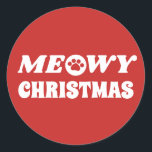 Meowy Christmas Runder Aufkleber<br><div class="desc">Diese Aufkleber zeigen den Text "MEOWY CHRISTMAS" in weißem Schriftart auf rotem Hintergrund an. Das "O" in MEOWY wird durch einen niedlichen Pfotendruck ersetzt. Das ist ein großartiges Produkt für Katzenliebhaber,  Haustierbesitzer,  Freiwillige für Tierheime,  Tierärzte,  Tierärzte und mehr!</div>