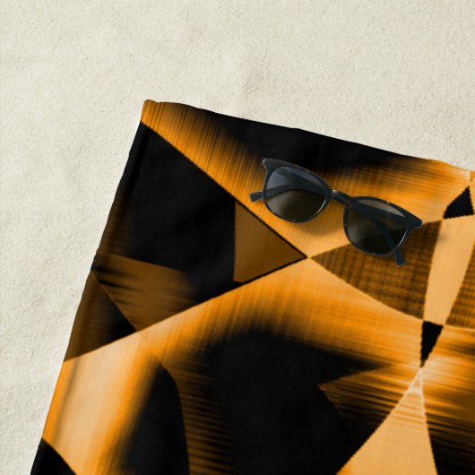 Merkwürdiges Gewirr verbrannter Bänder, orange und Strandtuch (Beispiel)