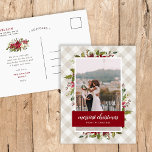 Merriest Christmas Winter Greenery Photo Feiertagspostkarte<br><div class="desc">Affordable custom printed holiday photo postcards with simple templates for customization. This festive design features an elegant watercolor floral border of holly leaves and flowers in red, green and burgundy colors on a neutral buffalo check plaid background. Personalize it with your photo and custom text. Postcard back has space for...</div>