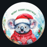 Merry Aussie Christmas Koala Runder Aufkleber<br><div class="desc">Eine sehr frohe Aussie Weihnachten mit dieser niedlichen koala Diese furry koala ist ein gebürtiger Australier sie sind leicht erkennbar durch ihren stinkenden,  taillen Körper und großen Kopf mit runden,  flauschigen Ohren und große,  löffelförmige Nase.</div>