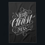 Merry CHRISTmas Christliche Chalkboard-Kalligraphi Geschirrtuch<br><div class="desc">Wir sagen "Frohe Weihnachten" sehr oft während der Saison, aber manchmal vergessen wir, woher dieser Gruß eigentlich kommt. Hier ist ein wunderbar elegantes Stück Handschrift, um einen sanften Rückstoß zurück in die Richtung Jesus geben. Die Kunst des beruflichen Kalligraphen Ivan Angelic. Dieses Schriftstück ist in Schwarz auf Weiß, Weiß und...</div>