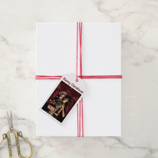 Merry Christmas. Funny skeleton with woman Geschenkanhänger (Mit Garn)