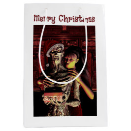 Merry Christmas. Funny skeleton with woman Mittlere Geschenktüte