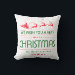 Merry Christmas Santa Claus Reindeer | Weihnachten Kissen<br><div class="desc">Dieses Design verfügt über einen Weihnachtsmann mit Rentier und Schlitten. Der Text "Wir wünschen Ihnen ein frohes Weihnachtsfest und ein glückliches Neues Jahr" ist in der modernen populären rot-grünen Typografie geschrieben. #christmas #decion #cushion #santa #holiday #saisononal</div>