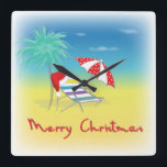 Merry Christmas, Santa Hat, Palm Tree, Beach Quadratische Wanduhr<br><div class="desc">Merry Christmas with Santa Hat,  Palm Tree,  Beach Umbrella and Chair Illustration by Inge Lewis.  Find more matching items at the ingeinc.com store.</div>