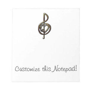 Metallisch verkleidete musikalische Treble Clef mi Notizblock