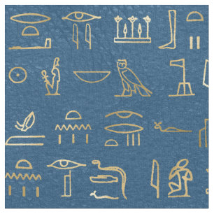 Metallische ägyptische Hieroglyphen auf blau Stoff